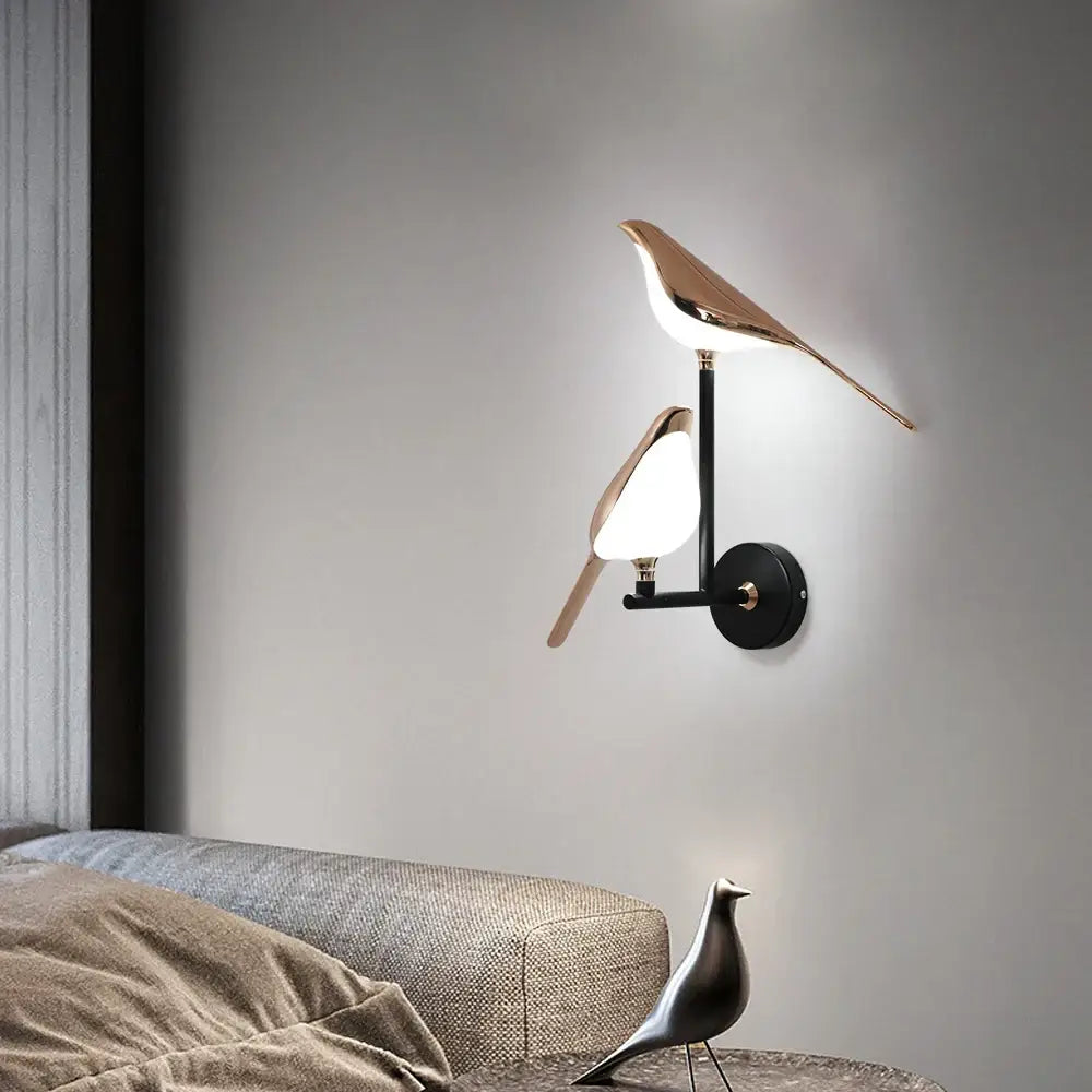 Modern bronze bird wall light pair with sleek rose gold and matte black metallic finish for living room decorbites bird wall