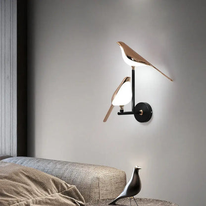 Modern bronze bird wall light pair with sleek rose gold and matte black metallic finish for living room decorbites bird wall