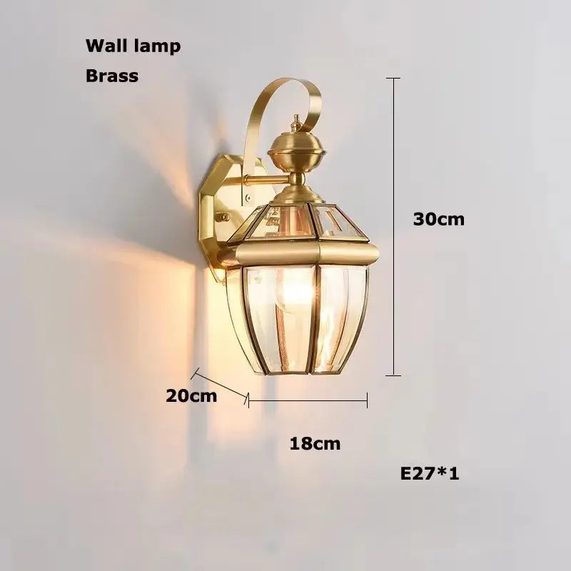 Brass wall lamp with classic lantern design and clear glass panels in decorbites bronze black chrome gold style