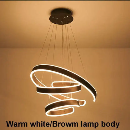 Modern pendant light with warm white led circle rings and brown acrylic body ideal for dining room decorbites circle rings