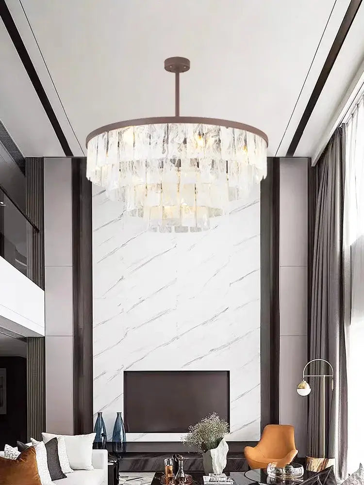 A modern bronze pendant light with circular frame and cascading clear crystal tiers for living room decorbites cloud glass led