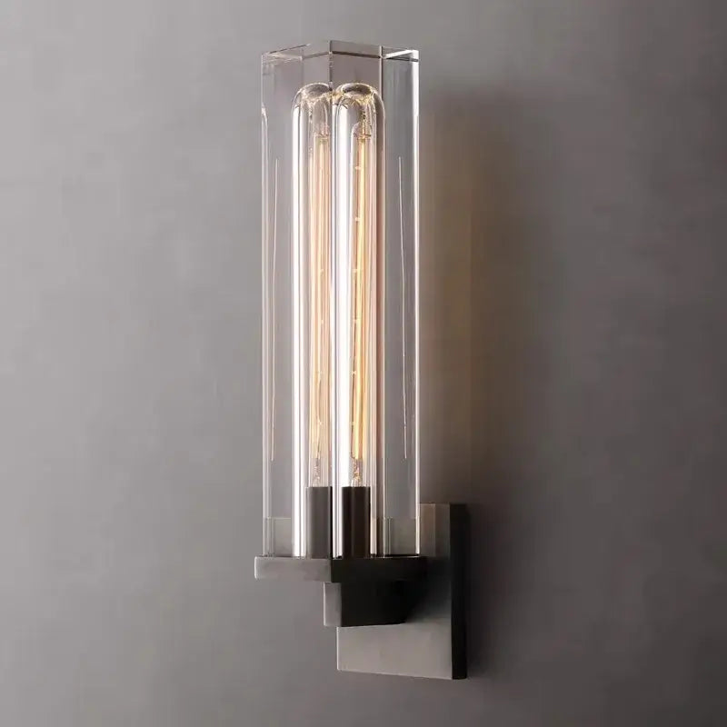Modern bronze copper crystal wall lamp features a wall sconce with clear glass housing and glowing filament bulbs on brushed metal base