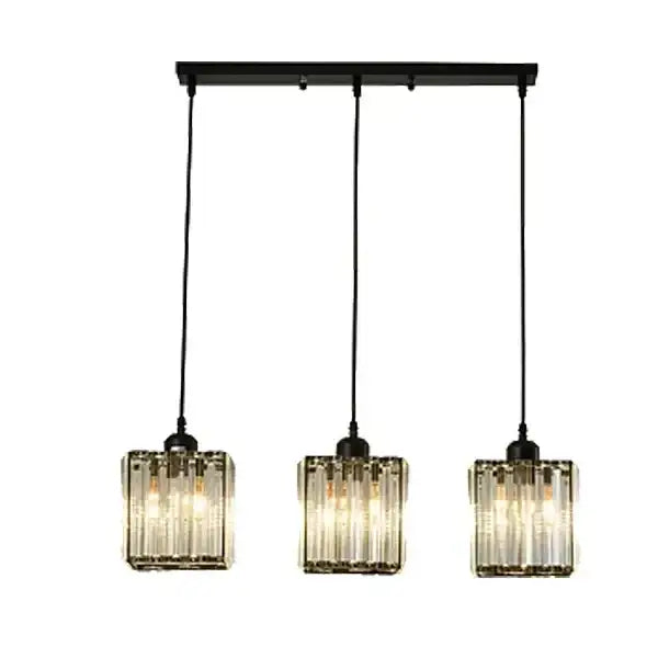Modern bronze crystal trio pendant light with black metal bar and vertical ribbed glass shades for dining room decorbites crystal trio