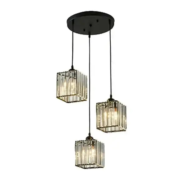 Black metal pendant light with three hanging glass cube shades featuring vertical ribbed detailing for dining room decorbites crystal trio