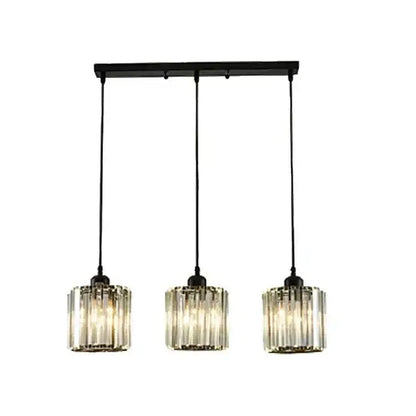 Modern bronze crystal trio pendant light with black metal bar and three cylindrical glass shades for dining room decorbites crystal trio