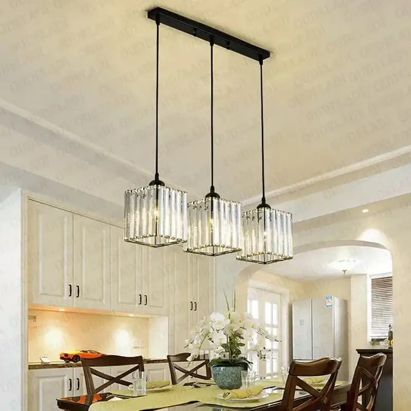 Modern bronze decorbites crystal trio pendant light with black metal bar and three hanging crystal pendant lights for dining room