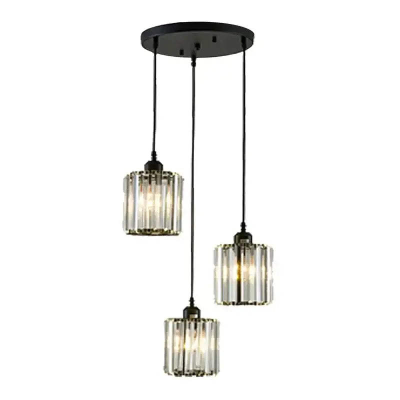 Modern bronze crystal trio pendant light with black metal fixture and three glass shades featuring vertical crystal rods