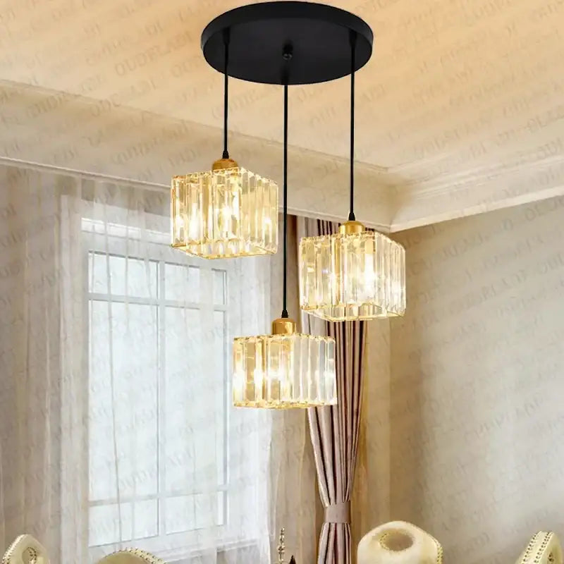 Modern bronze crystal trio pendant light with gold fixtures and black cords for dining room decorbites crystal trio