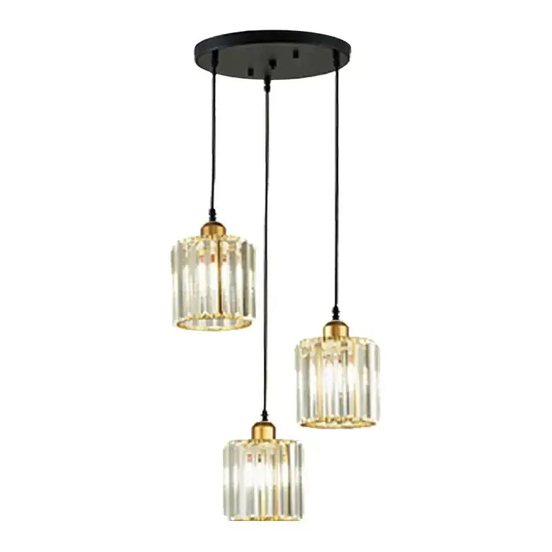 Modern bronze decorbites crystal trio pendant light with clear ridged glass shades and gold-toned metal for dining room decor