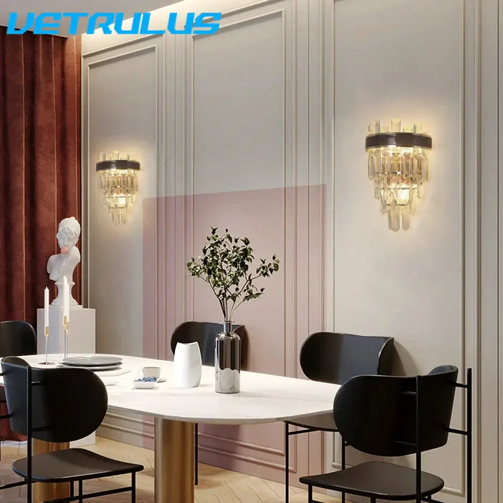 Modern bronze decorbites crystal led wall light featuring a black metal frame and cascading clear glass prisms wall light