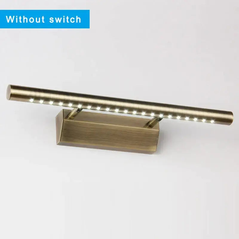 Modern bronze led mirror light with brass-finished wall mount and cylindrical bar housing decorbites bronze led whites