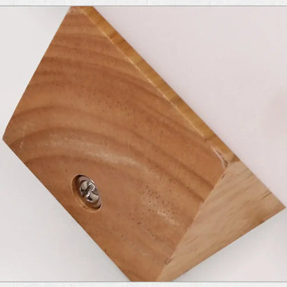 Light brown wooden triangular block with metallic screw, part of modern bronze led wooden wall sconce bedroom lamp decorbites led wooden wall