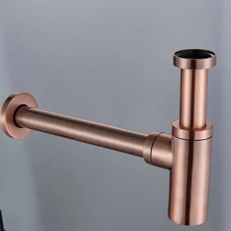 Modern bronze round siphon bottle trap bathroom sink drain pipe in copper tone with brushed metal finish and minimalist design