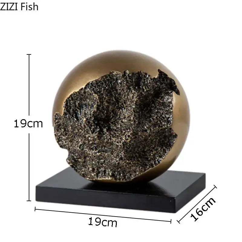 Modern bronze sphere sculpture desk ornament with gold-toned exterior and textured dark interior on black base decorbites bronze sphere