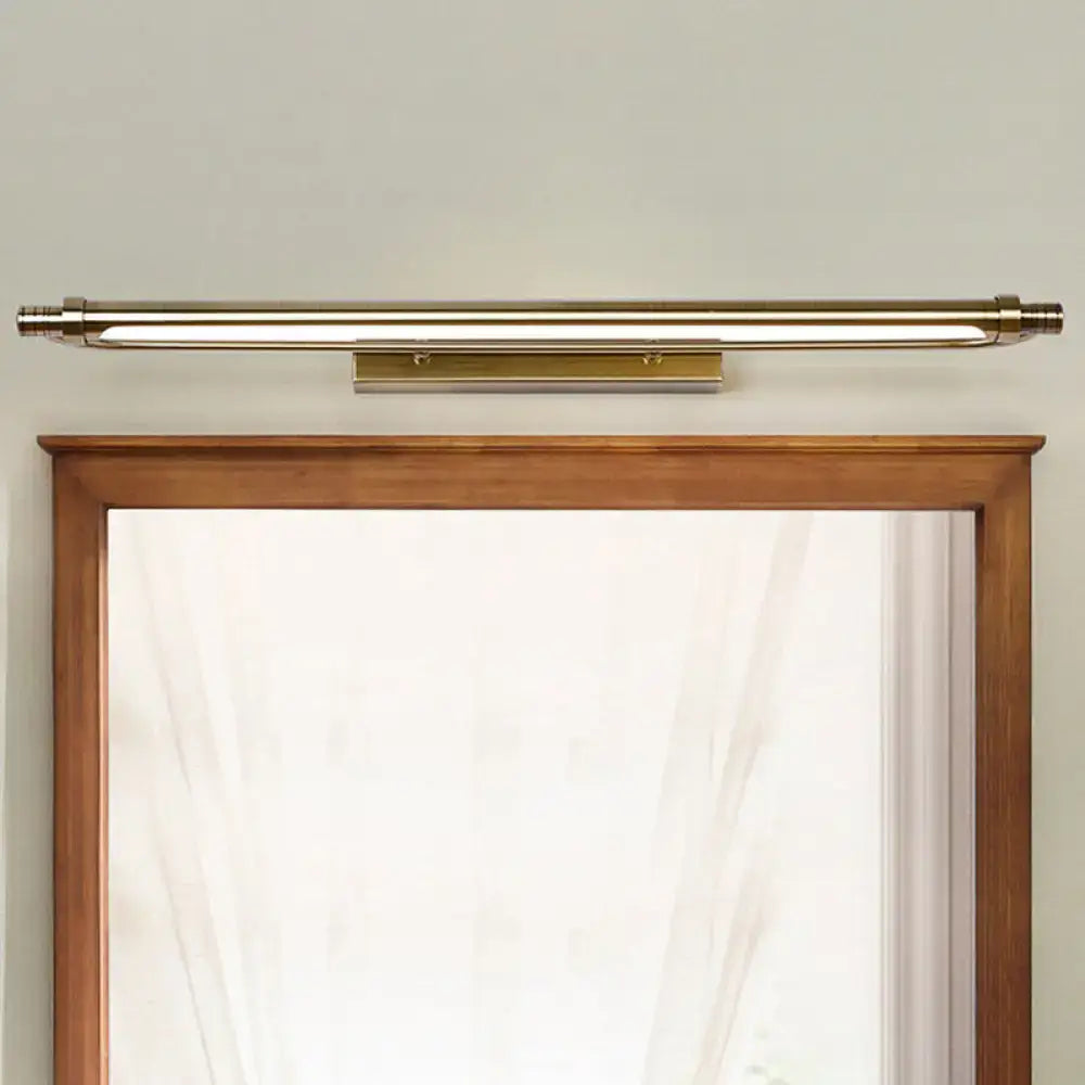 Brass-finished tubed vanity light fixture with sleek modern design providing warm white lighting for bathrooms