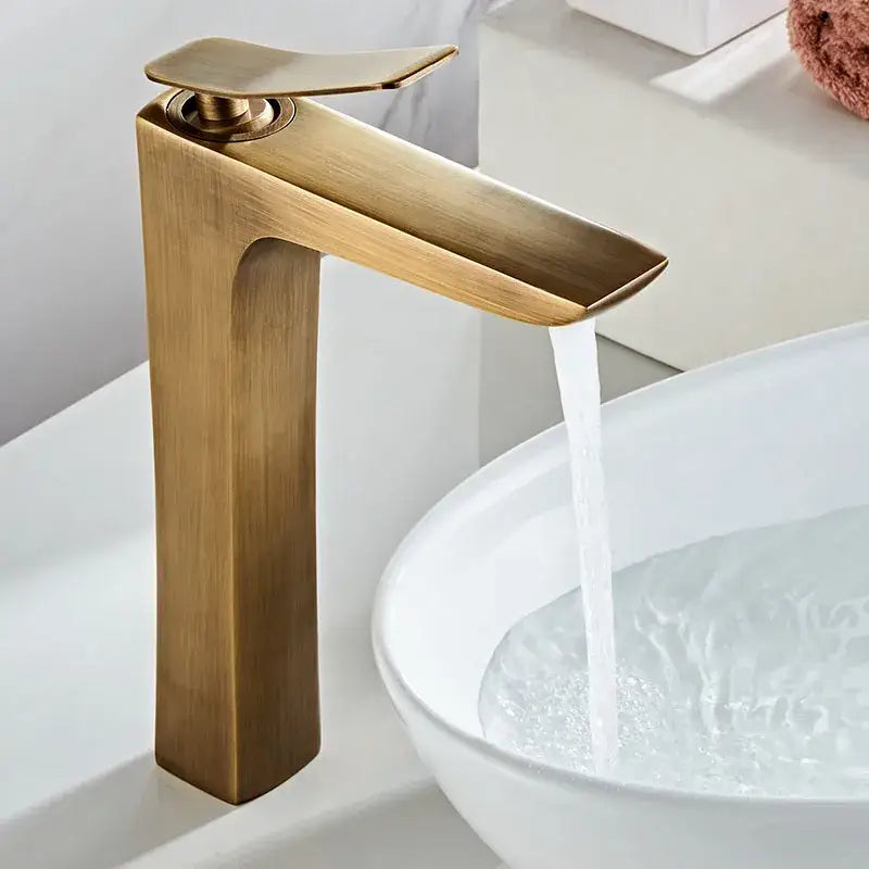 Brass-finished modern bronze basin faucet with sleek rectangular spout and tall cylindrical body for bathroom sink use
