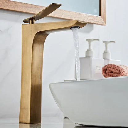 Modern bronze basin faucet with brass finish and sleek angular waterfall design for bathroom sink use by decorbites