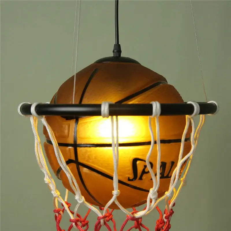 Modern brown basketball pendant lights featuring a warm-glowing spalding ball with white and red netting decorbites basketball pendant