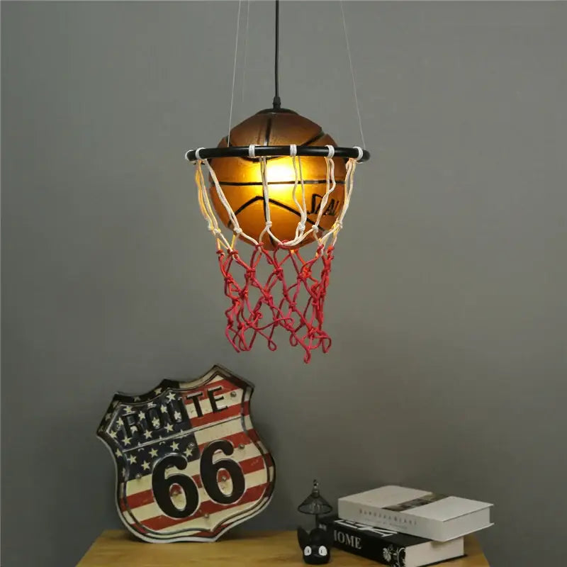 Modern brown basketball pendant lights featuring a warm glowing vintage orange ball and red netting for kids room decorbites basketball pendant