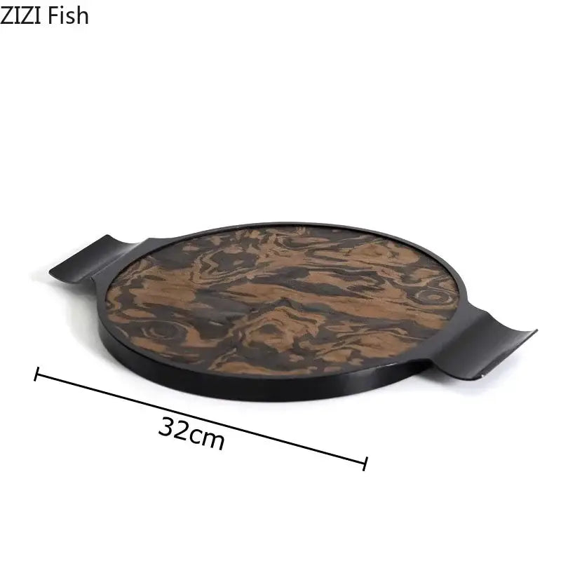Black-framed circular serving tray with swirling brown wood-grain auspicious clouds texture for jewelry box display