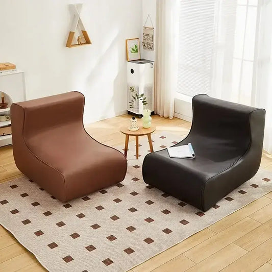 Two modern minimalist sofa chairs in brown and black smooth faux leather perfect as cozy sofa chairs for living room
