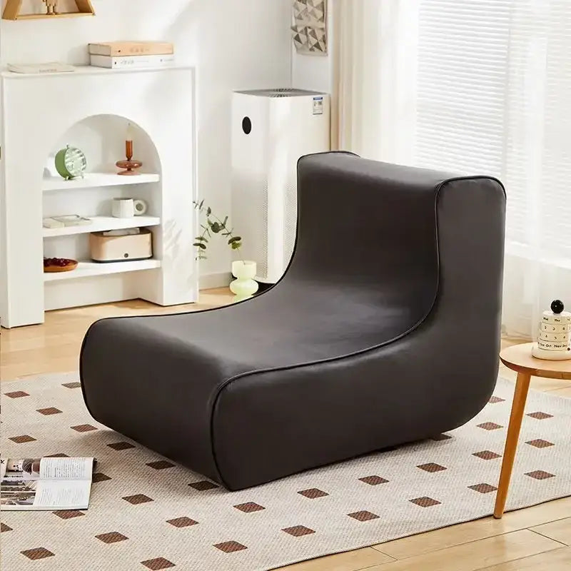 Modern brown and black leather-like lounge chair with sleek curved contours for internet celebrity lazy sofa decorbites