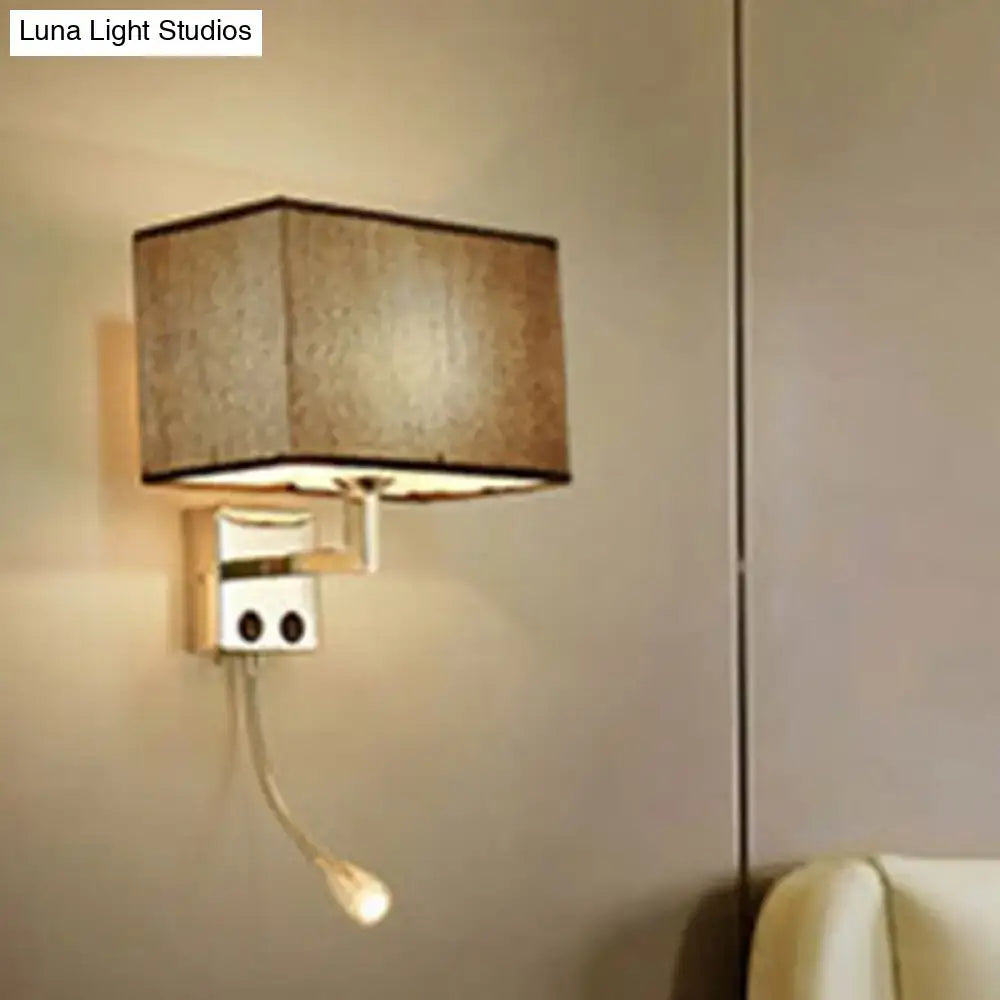 Modern brown and chrome bedroom spotlight wall lamp with a beige fabric rectangular lampshade and adjustable reading light