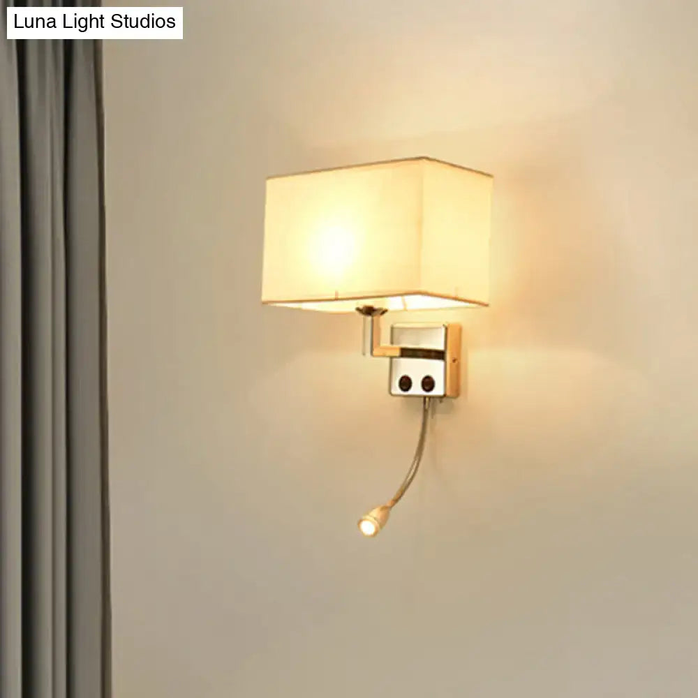 Modern brown and chrome bedroom spotlight wall lamp with a square off-white shade and adjustable reading light