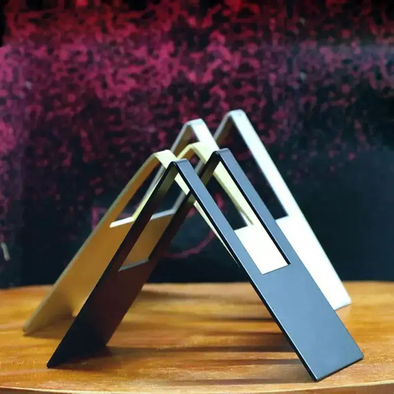 Three sleek triangular metallic phone stands in black gold and white for decorbites coffee filter holder storage rack
