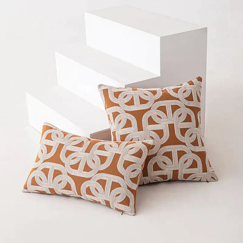 Two rectangular brown coffee geometric cushion covers in burnt orange and cream woven fabric for living room decorbites decor