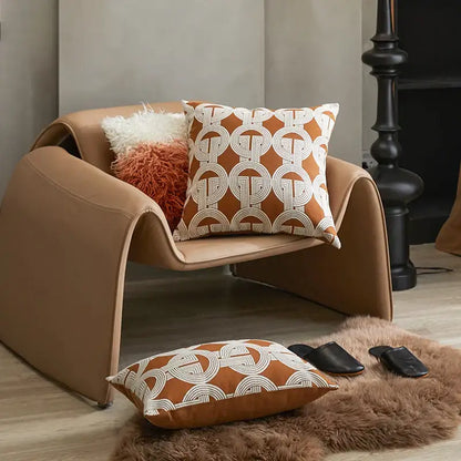 Tan leather armchair with sleek curved design complementing decorbites brown coffee geometric cushion cover for living room decor