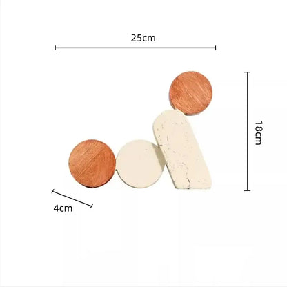 Set of four minimalist geometric circle resin handicrafts coasters in natural wood tones and matte cream decorbites style