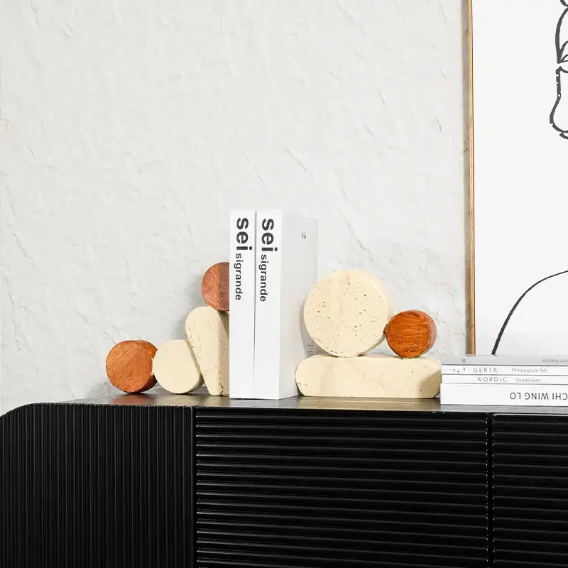 Cream-colored speckled geometric circle resin bookends with smooth rounded edges and matte finish for living room decorbites