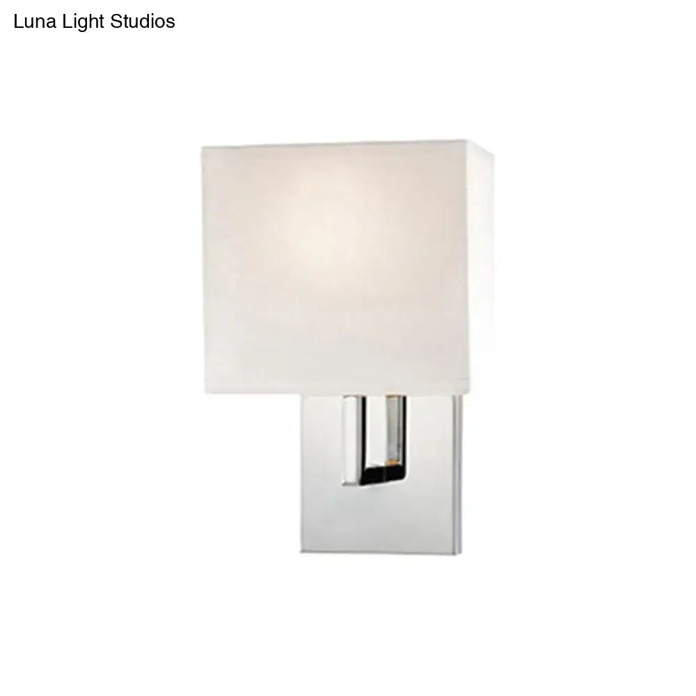Modern brown fabric wall mount sconce with frosted white shade and polished chrome base for bedroom lighting