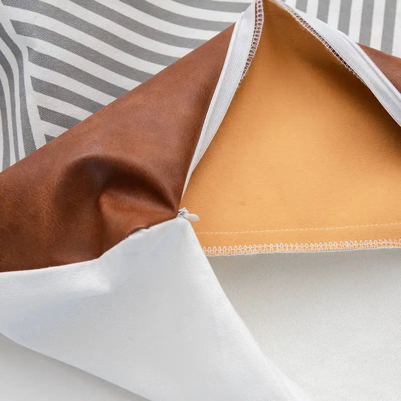 Modern brown faux leather pillow cover with white lining and zipper closure for living room decorbites brown faux decor