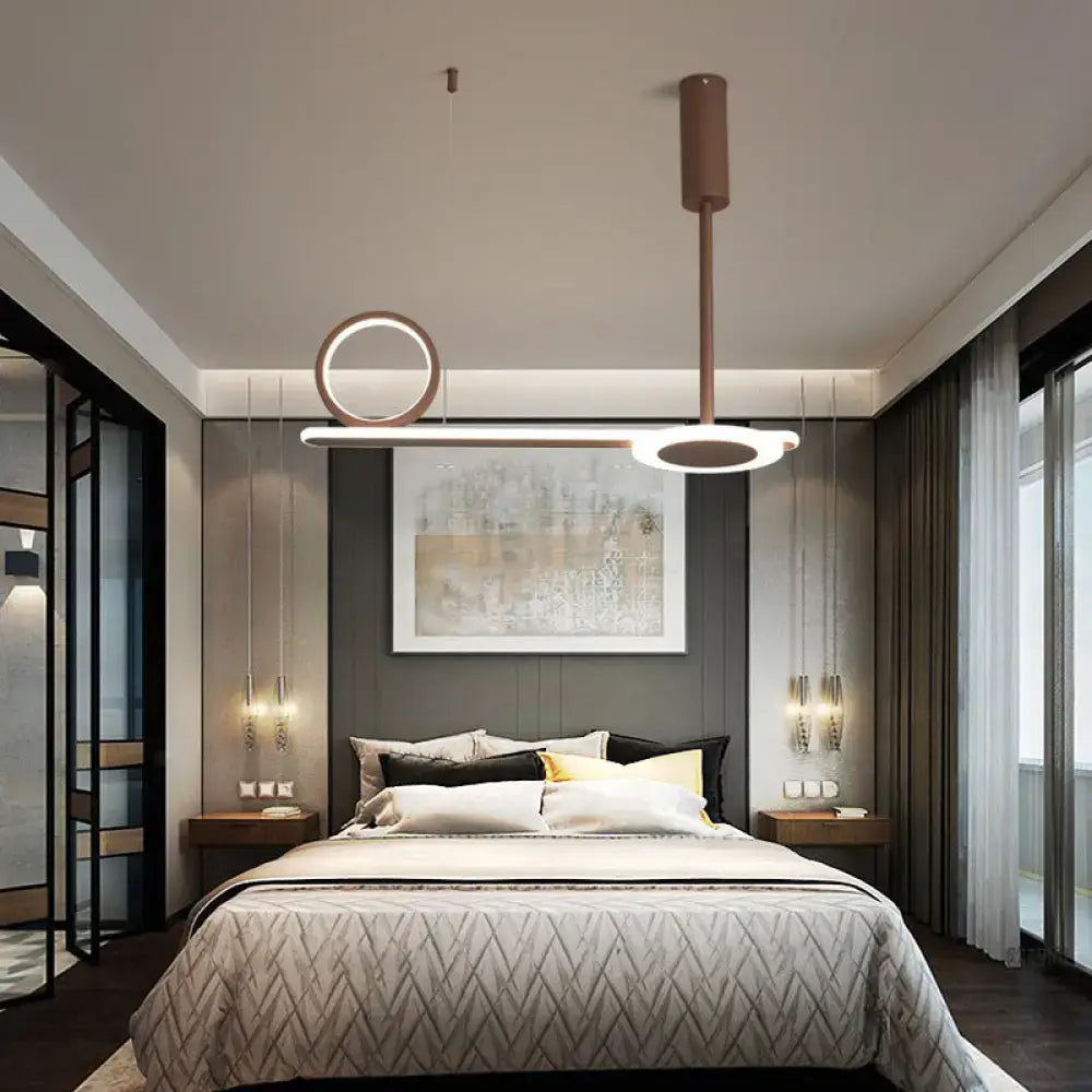 Modern brown metal ring hanging light with copper-toned pendant and circular linear led elements for bedroom use