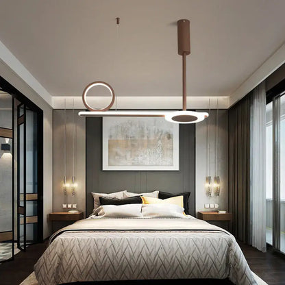 Modern brown metal ring hanging light with copper-toned pendant and circular linear led elements for bedroom use