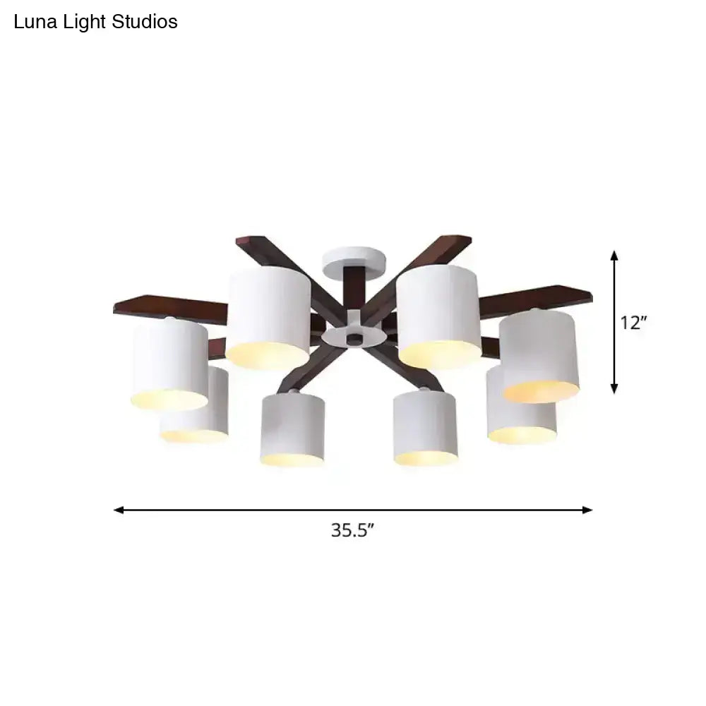 Modern brown and white ceiling mount chandelier with six cylindrical shades and dark wood arms for living room lighting