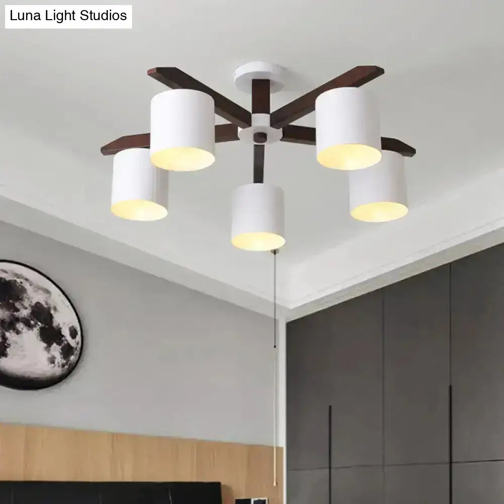 Modern brown and white ceiling mount chandelier with five cylindrical shades and dark wood arms for living room lighting