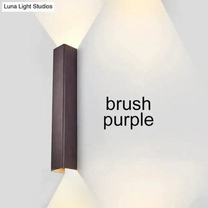 Modern brushed aluminum rectangular wall sconce in purple with a sleek matte finish for bedroom ambient lighting