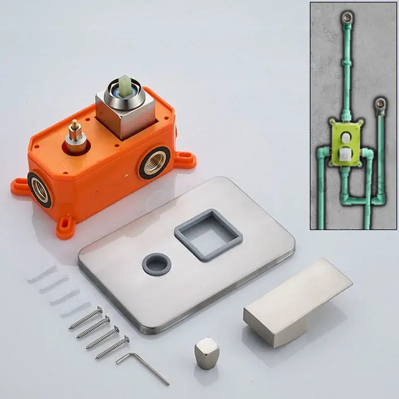 Modern brushed brass and orange shower mixer valve showing orange plastic housing with metallic components and stainless steel faceplate