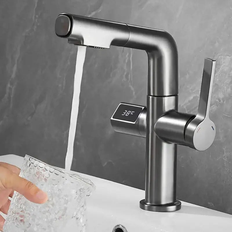 Modern brushed brass basin faucet with digital temperature display showing 38°c for precise bathroom use