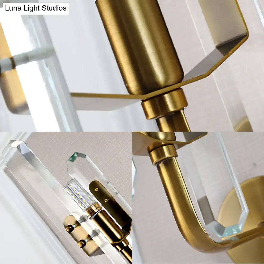 Modern brushed brass living room wall mounted sconce light with crystal shade and clear LED bulb accents