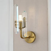 Modern brushed brass sconce light with two clear crystal shade accents for living room wall mounting