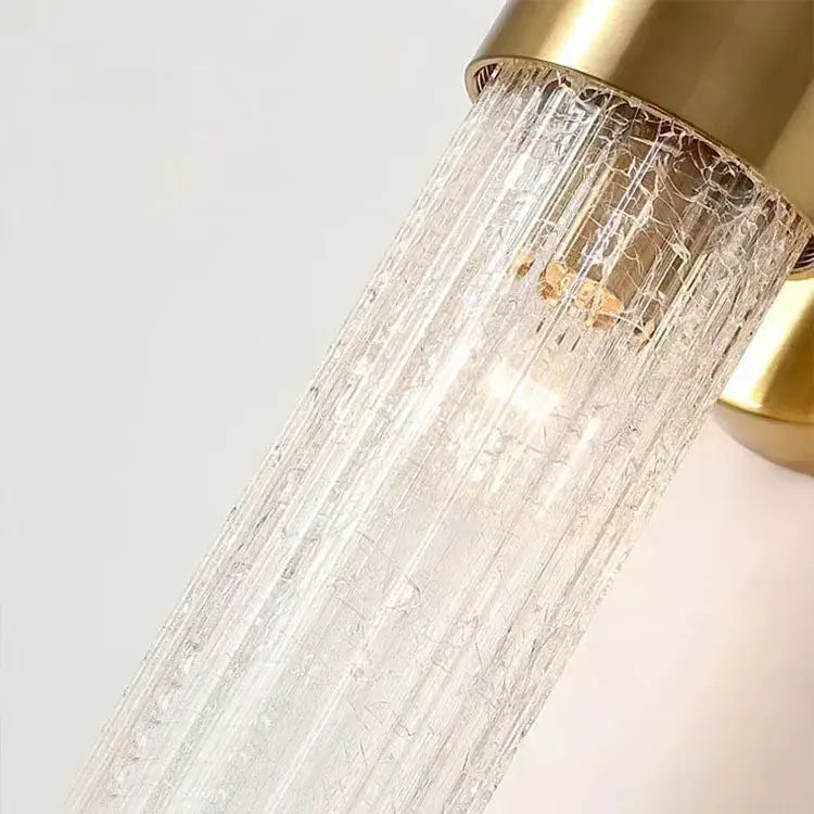 Modern brushed brass crystal wall lamp with gold metal base and clear textured glass shade for bedroom wall lamp decorbites crystal wall