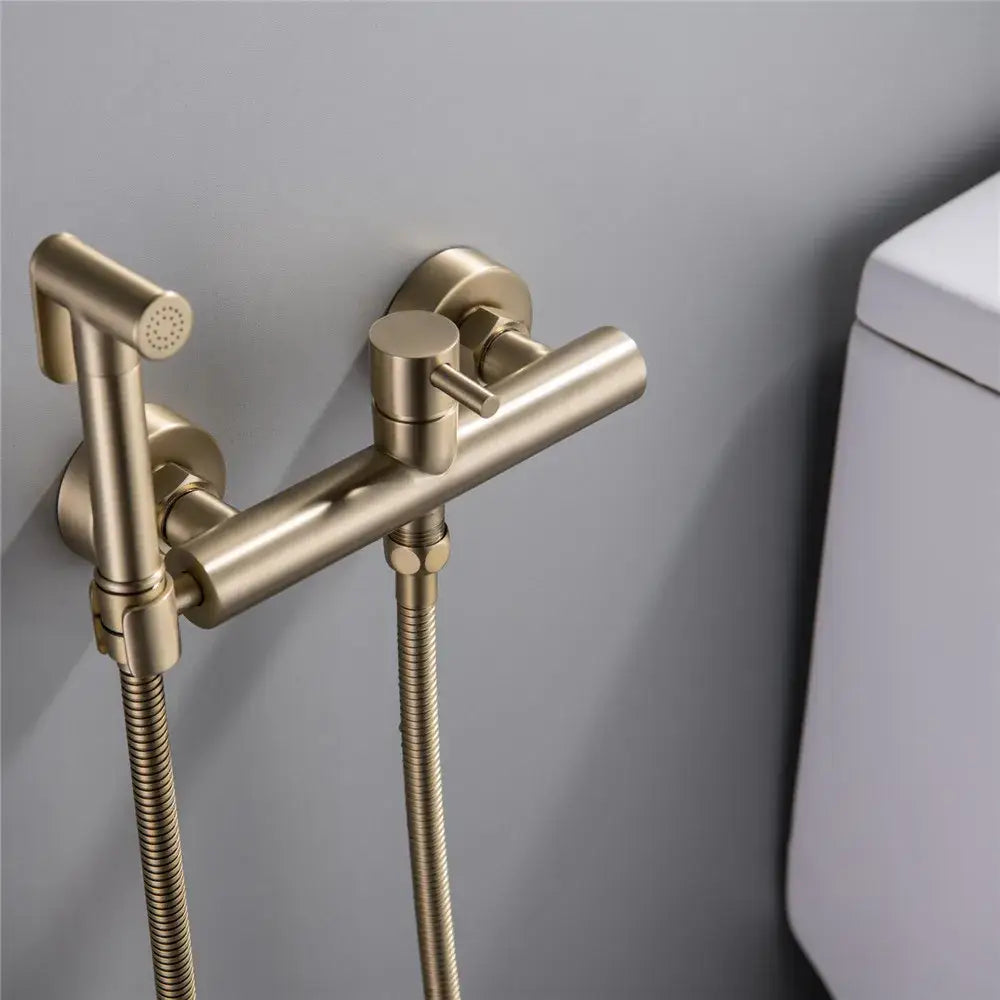 Modern brushed brass hand held bidet sprayer kit with brushed gold finish and flexible hose for bathroom use