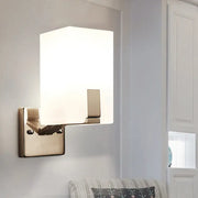 Modern brushed brass wall sconce with rectangular frosted glass shade for bedroom light type illumination