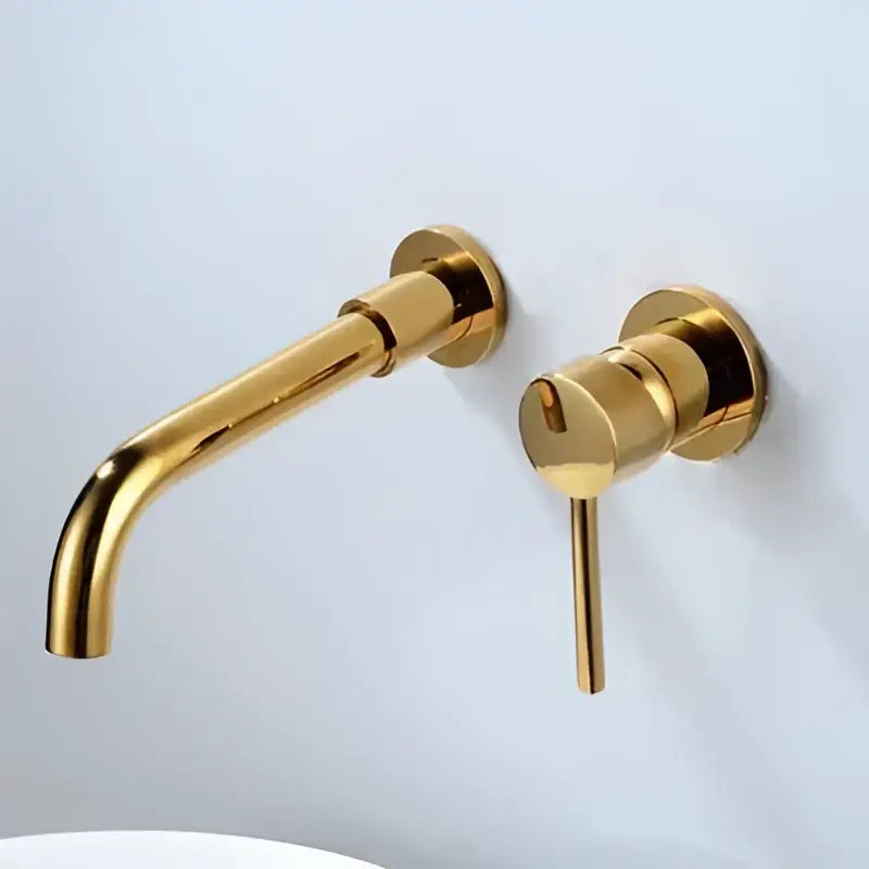 Modern brushed gold and black basin faucet set featuring a gold-finished wall-mounted basin faucet with matching handle