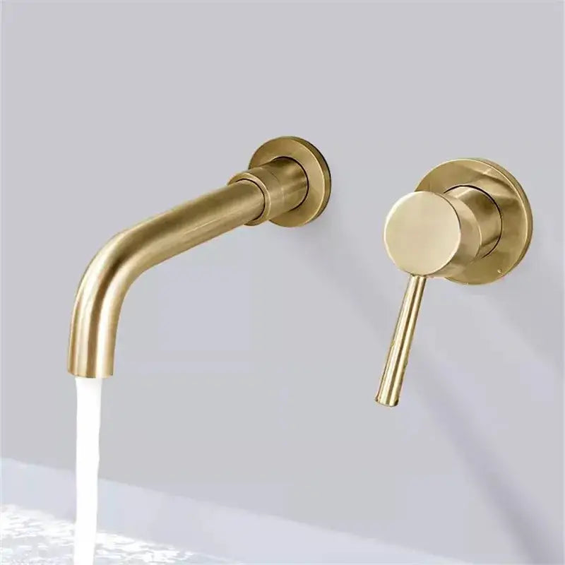 Modern brushed gold and black basin faucet set featuring brass-finished wall-mounted faucet with curved spout and handle