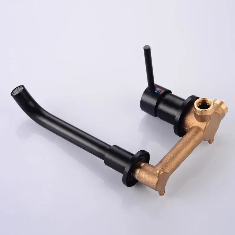 Modern brushed gold and black basin faucet set with brass curved spout and dual-handle control for bathroom sink